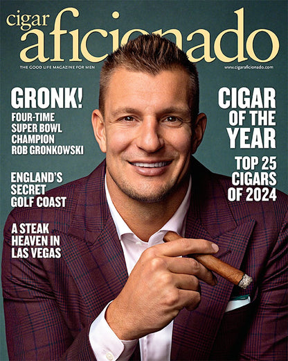 Magazine cover featuring a man holding a cigar with text about Rob Gronkowski and top cigars of 2024.