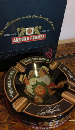 Arturo Fuente cigar ashtra with branding and decorative elements.